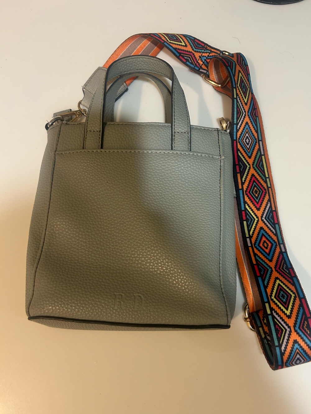 Rae Dunn gray Pebbled Crossbody with Colorful Woven Strap